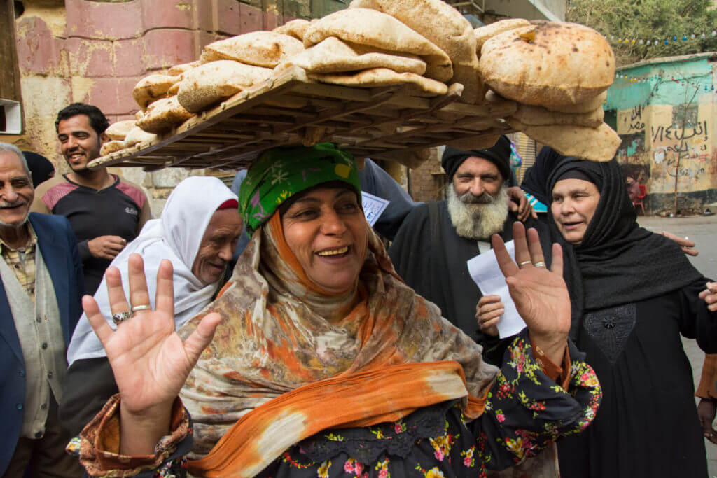 Bread Seller among Pilgrims